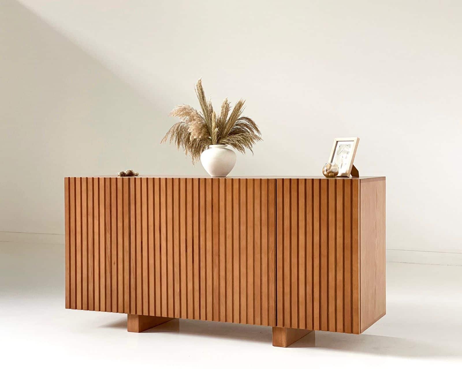Slatted Buffet, a stylish and versatile addition to your dining area or living space. Crafted with premium materials and attention to detail, this buffet combines modern design with practical functionality to enhance your home decor